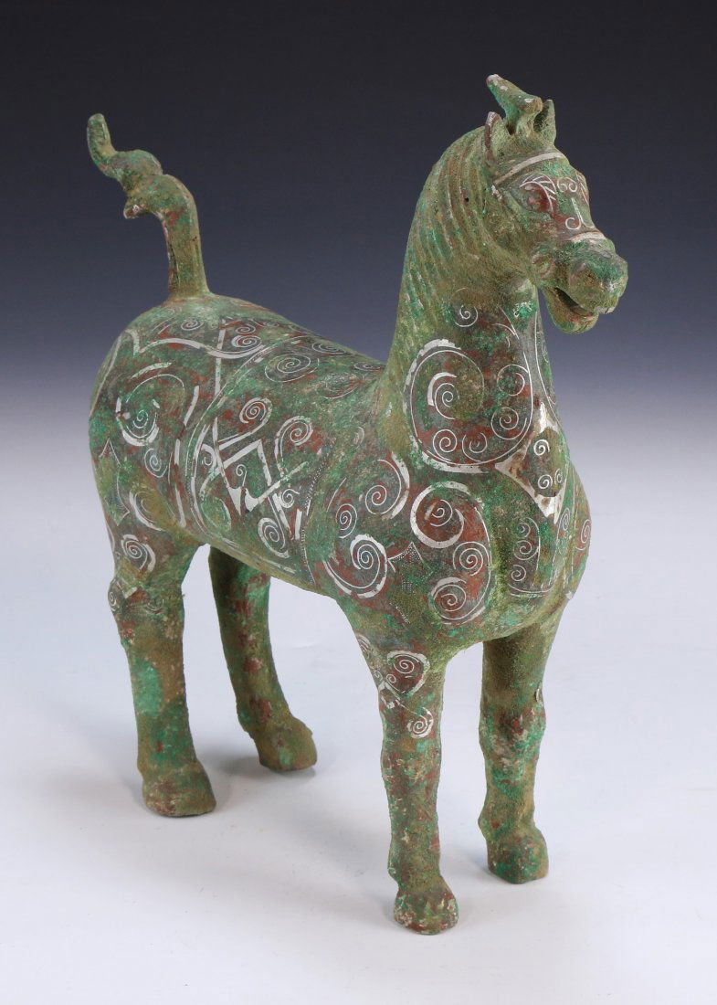 A CHINESE ARCHAIC SILVER INLAID BRONZE HORSE (1 of 7)