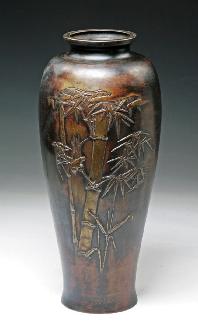 A JAPANESE ANTIQUE BRONZE VASE: A Japanese Antique Bronze Vase: Of Shouldered Body With Short And Wide Neck, With The Design Of Bamboo Tree in Relief On One Side, Circa 1900; Size: H: 13" (33.02cm)
