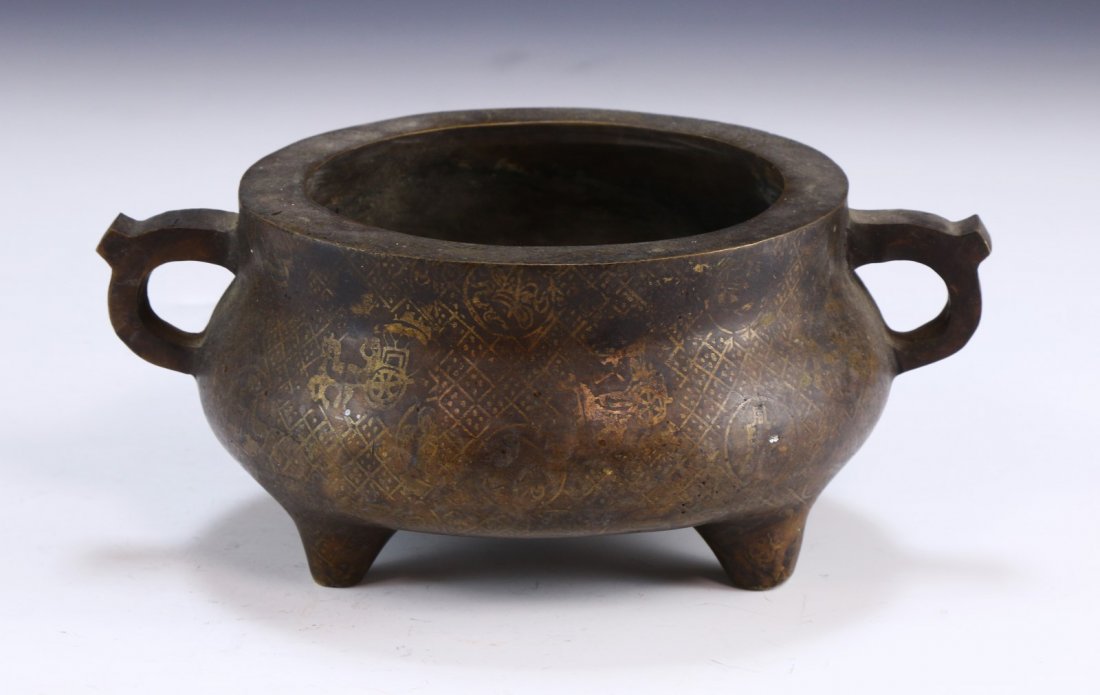 A CHINESE ANTIQUE TRIPOD BRONZE CENSER: A Chinese Antique Tripod Bronze Censer: Of Compressed Globular Form Rested On Three Low Feet, Curling Handles Flanking Each Side Of The Cylindrical Rim, Body Subtly Etched With Small Horse Drawn Carri