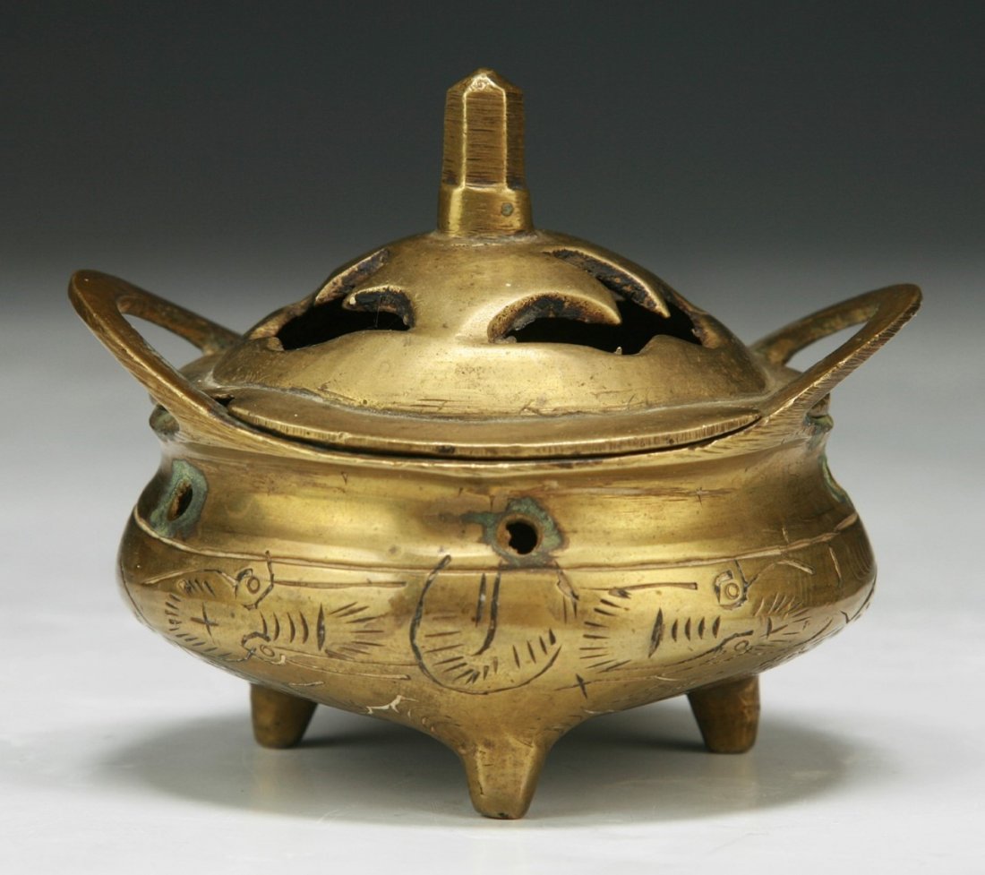A CHINESE ANTIQUE GILT BRONZE TRI-POD CENSER: A Chinese Antique Gilt Bronze Tri-Pod Censer: With xuande Mark Cast On The Base But Of Qing Dynasty; Size: D: 3-1/4" (8.3cm)