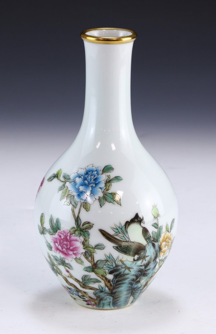 A CHINESE ANTIQUE GILT FALANGCAI PORCELAIN VASE: A CHINESE ANTIQUE GILT FALANGCAI PORCELAIN VASE: of ovoid form, a slim and cylindrical neck rising to a slightly flared and gilt glazed rim, body finely enamelled with two birds perched near blooming