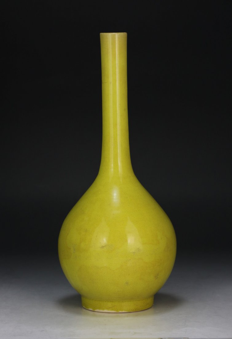 A Chinese Antique Yellow Glazed Porcelain Vase: A Chinese Antique Yellow Glazed Porcelain Vase: Of Globular Form Rising To A Cylindrical Neck, With An All Over Yellow Glaze; Size: H: 12" (30. 48cm)