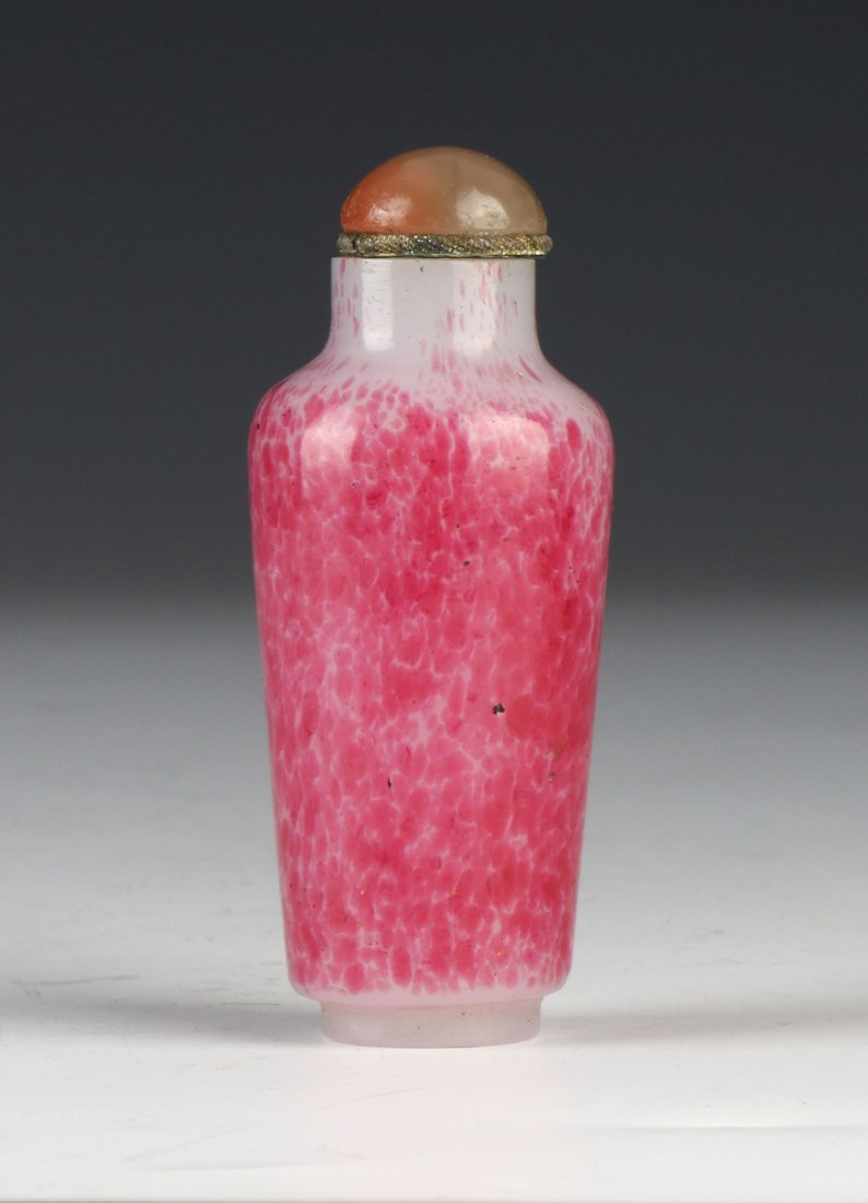 A CHINESE ANTIQUE PINK SPLASHED PEKING GLASS SNUFF: A Chinese Antique Pink Splashed Peking Glass Snuff Bottle; Size: H: 3" (7.62cm)