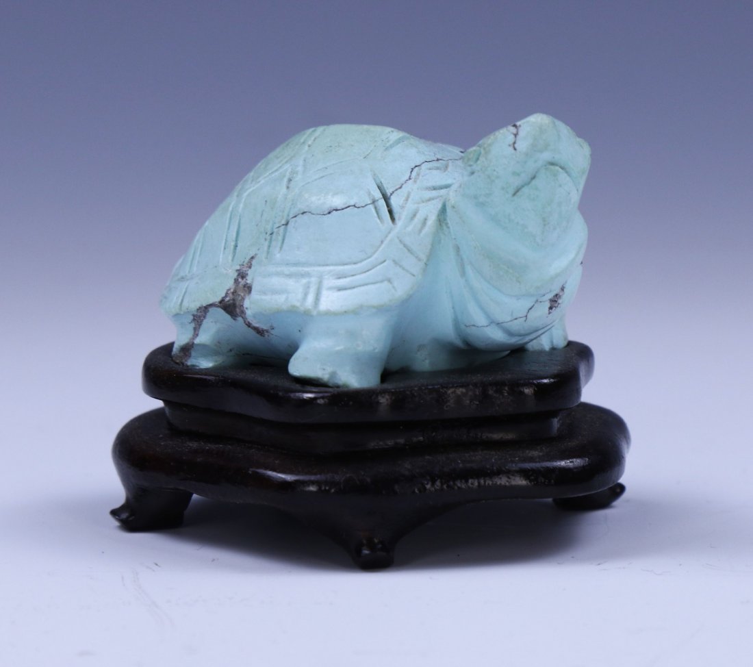 A CHINESE ANTIQUE TURQUOISE CARVED TURTLE: A Chinese Antique Turquoise Carved Turtle: Presented On A Custom Wood Stand; Size: L: 2" (5.08cm)
