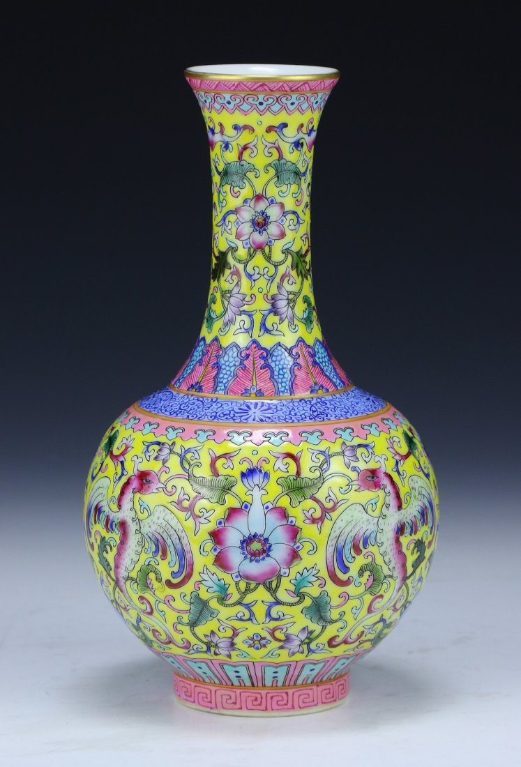 A Chinese Antique Famille Rose Porcelain Vase: A Chinese Antique Famille Rose Porcelain Vase: Of Globular Form Rising To A Cylindrical Neck And Slightly Flared Rim, The Body Finely Painted With Phoenix, Blooming Flowers, And Scrolling Vines On A Y