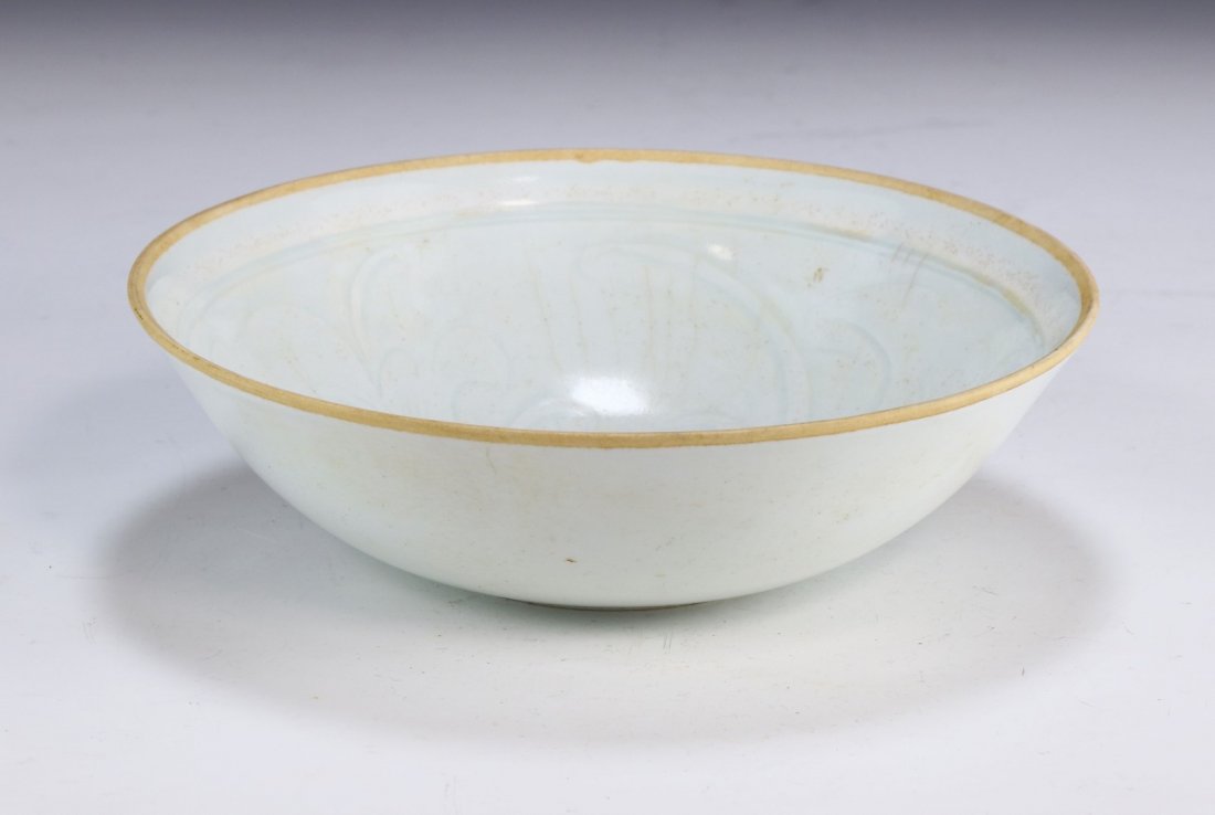 A CHINESE ANTIQUE CELADON GLAZED PORCELAIN BOWL: A Chinese Antique Celadon Glazed Porcelain Bowl: Finely Painted Along The interior With A Large Blooming Flower Figure; Size: D: 8" (20.32cm)
