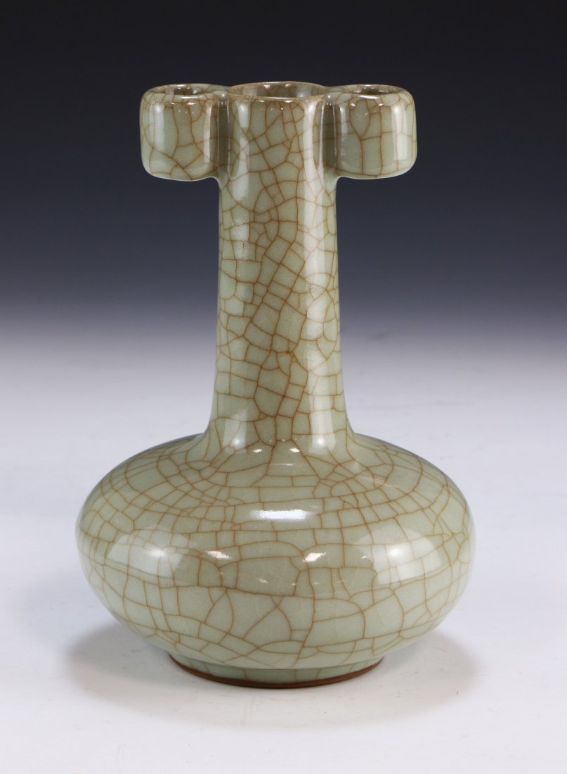 A CHINESE ANTIQUE CELADON GLAZED PORCELAIN VASE: A Chinese Antique Celadon Glazed Porcelain Vase: Body Of Compressed Globular Form, Rising To A Cylindrical Neck Flanked On Each Side By Hollow And Cylindrical Handles, Finely Glazed Throughout With A