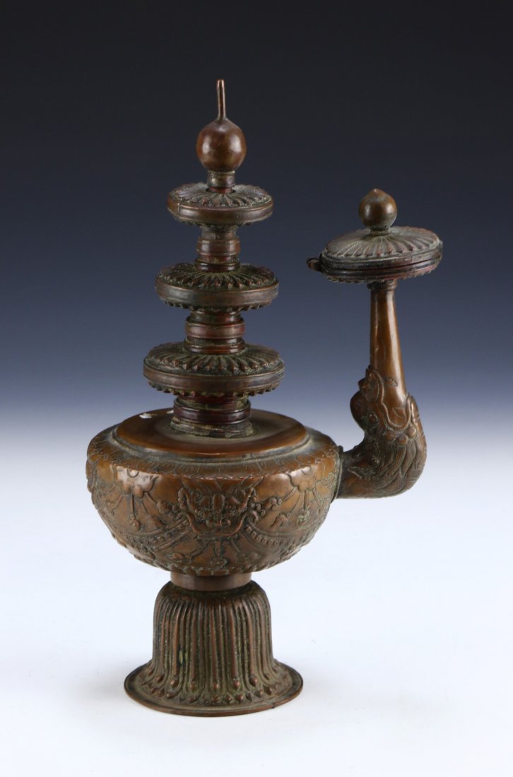A TIBETAN SILVERED CANDLE HOLDER (1 of 6)