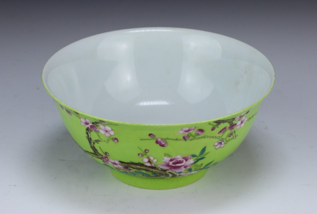 A CHINESE ANTIQUE FAMILLE ROSE BOWL: A Chinese Antique Famille Rose Bowl: Cylindrical Form, Finely Painted With Blooming Flowers And Branches, Against A Light Green Background, Signed On The Base With A Four-Character Yongzheng in Enamel