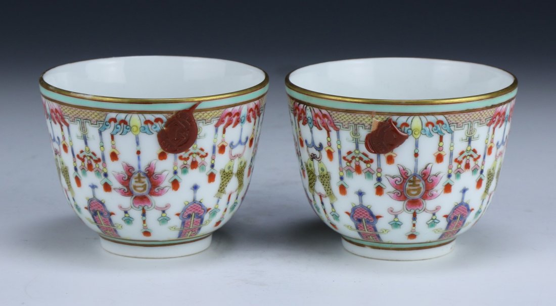 PAIR CHINESE ANTIQUE FAMILLE ROSE CUPS: Pair Chinese Antique Famille Rose Cups: Ending in Slightly Flared Golden Rim, Decorated Finely With Fish On Hooks And Various Plants, Signed On The Base With A Six-Character Daoguang in Iron Red; Size
