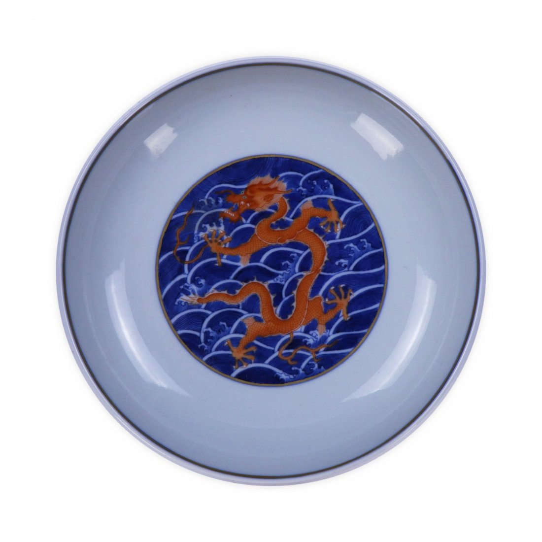 A CHINESE ANTIQUE BLUE & WHITE IRON RED PORCELAIN PLATE: A Chinese Antique Blue & White Iron Red Porcelain Plate: Finely Painted Along The Exterior Rim And interior Base With Swirling Dragon Figures Amid Scrolling Clouds, Six Character Yongzheng Mark On The