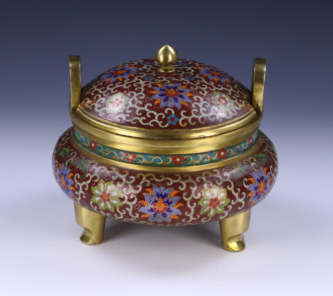 A CHINESE ANTIQUE GILT CLOISONNE ON BRONZE CENSER: A Chinese Antique Gilt Cloisonne On Bronze Censer: Of Compressed Globular Form, Domed Lid Topped With A Pointed Finial And Flanked On Each Side By High Arching Gilt Finished Handles, Body Finely Ename