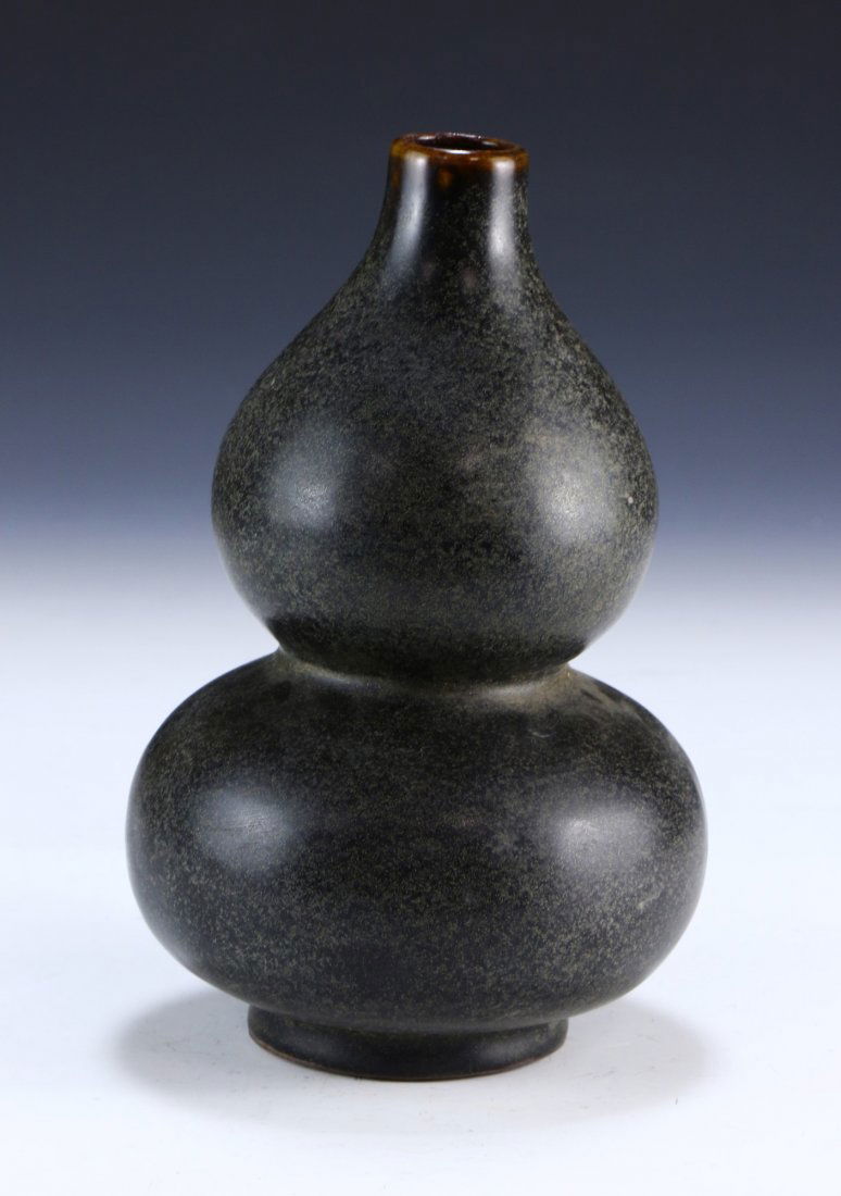 A Chinese Antique Black Glazed Porcelain Vase: A Chinese Antique Black Glazed Porcelain Vase: Of Gourd Form, Small And Cylindrical Neck Rising To A Flat Rim, Body With A Dusty Black Finish Throughout; Size: H: 8" (20.32cm)