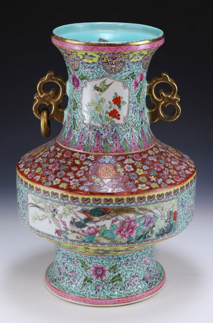 A BIG CHINESE ANTIQUE FAMILLE ROSE PORCELAIN VASE: A Big Chinese Antique Famille Rose Porcelain Vase: Of Baluster Form, Finely Decorated With Flowers Alongside The Body, Leading Up To The Neck Adorned With Golden Handles, Ending With A Slightly Flared