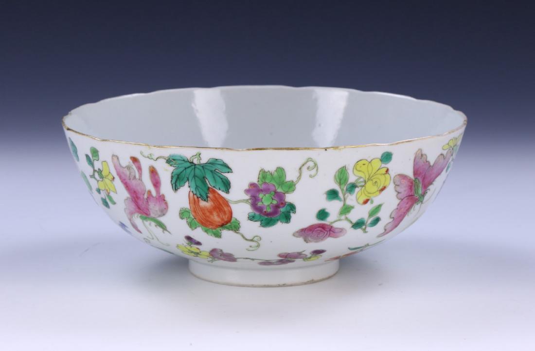 A BIG CHINESE ANTIQUE FAMILLE ROSE PORCELAIN BOWL: A Big Chinese Antique Famille Rose Porcelain Bowl: Deep And Finely Potted With Rounded Sides, Rising From A Base Rested On Low Feet, Exterior Finely Painted With Blooming Flowers Of Mixed Tones Amid L