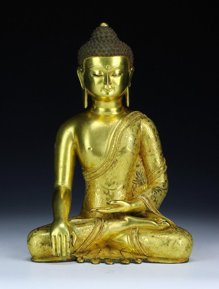 A GILT BRONZE FIGURE OF SHAKYAMUNI BUDDHA (1 of 4)