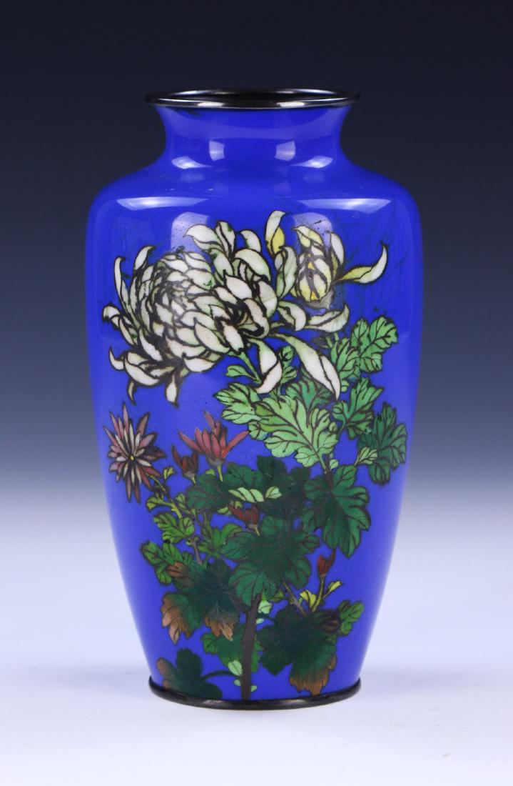 A JAPANESE ANTIQUE CLOISONNE VASE: A Japanese Antique Cloisonne Vase: Of Shouldered Form, The Body Finely Painted With Blossoming Branches Amid An Even Royal Blue Enameled Ground; Size: H: 7-1/4" (18.42cm)