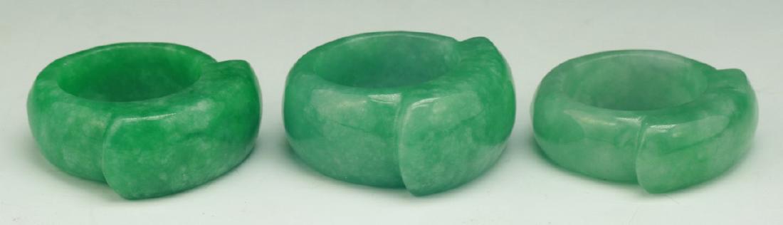 THREE (3) JADEITE OR LIKE RINGS (1 of 3)
