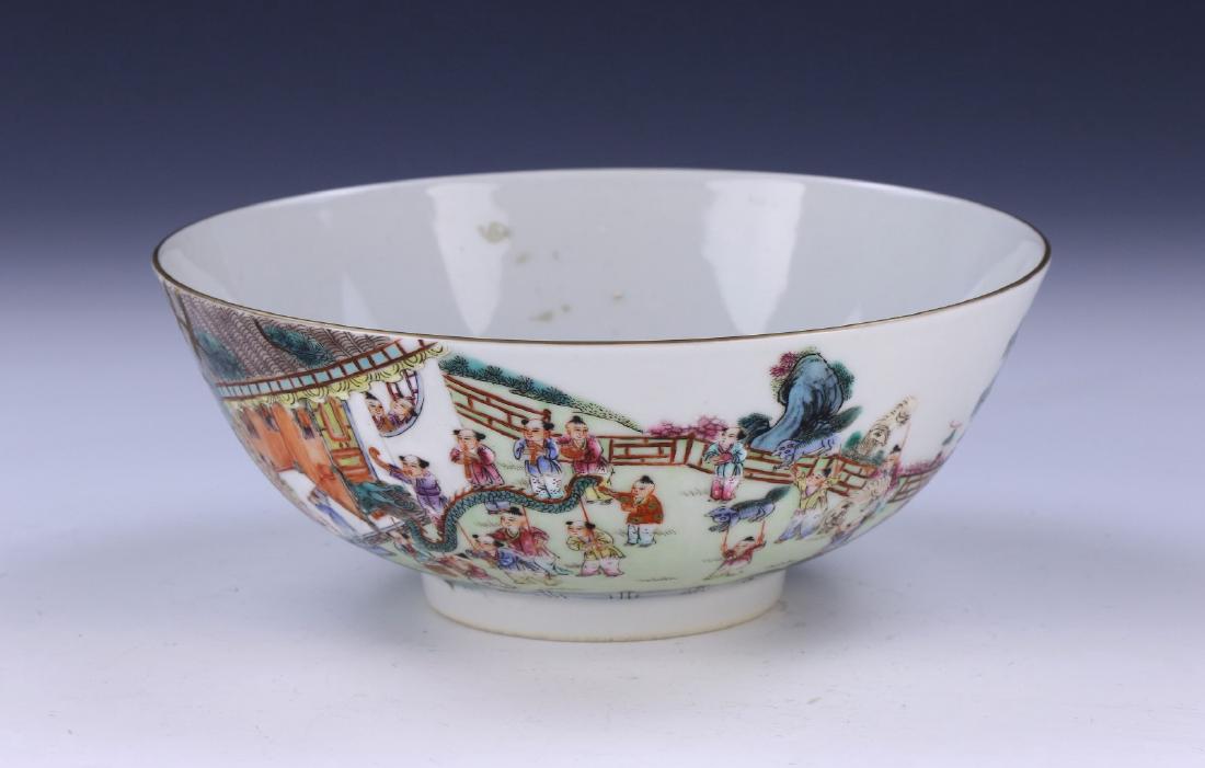 A CHINESE ANTIQUE FAMILLE ROSE PORCELAIN BOWL: A Chinese Antique Famille Rose Porcelain Bowl: Deep And Finely Potted With Rounded Sides, Exterior Finely Painted With A Large Courtyard Scene, Six Character 'Qianlong' Mark On The Base in Cobalt Blue