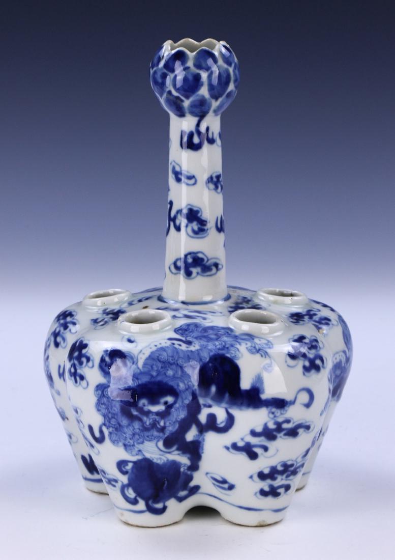 A CHINESE ANTIQUE BLUE & WHITE SIX HOLE PORCELAIN VASE: A Chinese Antique Blue & White Six Hole Porcelain Vase: Domed Body Rising To A Cylindrical Neck And Bulbous Rim, Finely Painted With Lion Dogs Amid Clouds, Four Character Qianlong Mark in Cobalt Blue