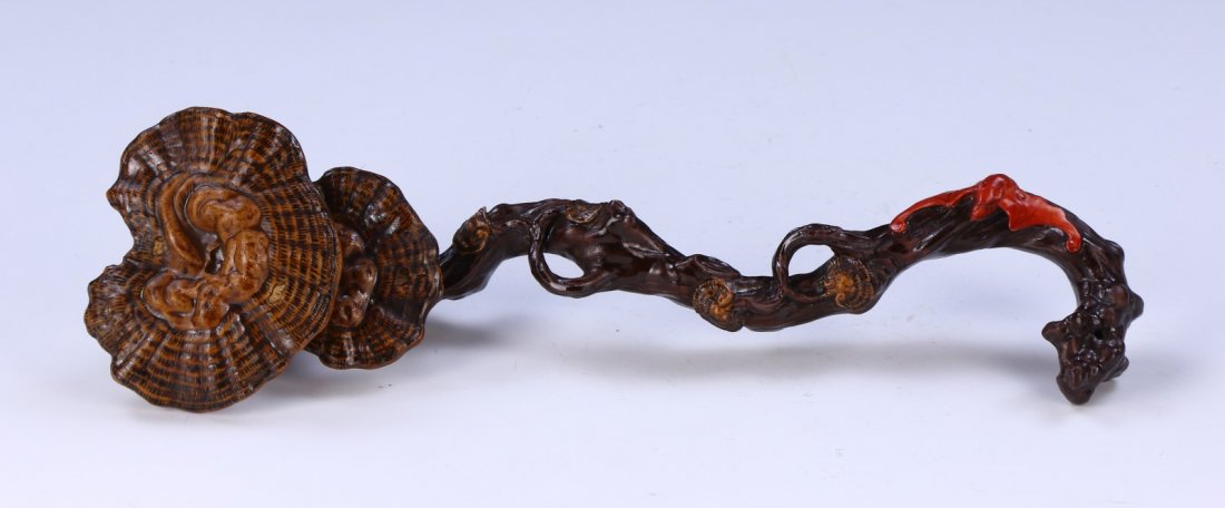 A CHINESE ANTIQUE PORCELAIN RUYI: A CHINESE ANTIQUE PORCELAIN RUYI: finely painted ruyi as the head made of large lingzhi as smaller vines bloom down the body, with a vibrant orange glazed bat near the bottomSize: L: 11-1/2" (29.21cm)