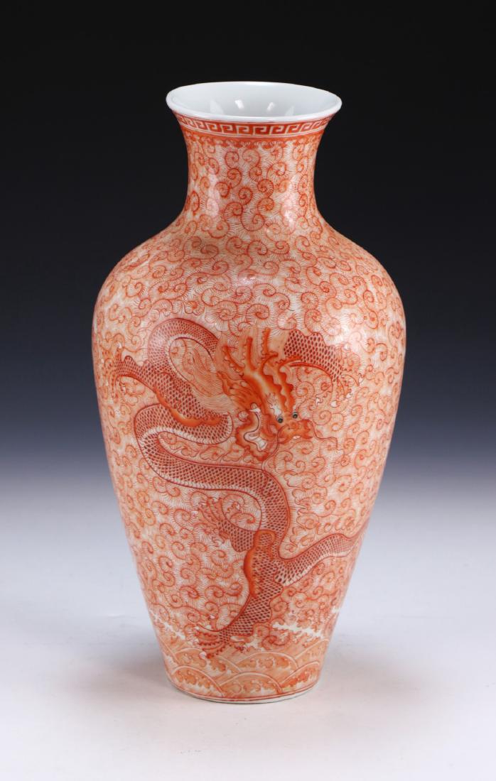 A CHINESE ANTIQUE FAMILLE ROSE PORCELAIN VASE: A Chinese Antique Famille Rose Porcelain Vase: Of Shouldered Form, Body Finely Painted With A Swirling Dragon On Each Side Amid Continuous Curling Geometric Patterns, Four Character Qianlong Mark On T