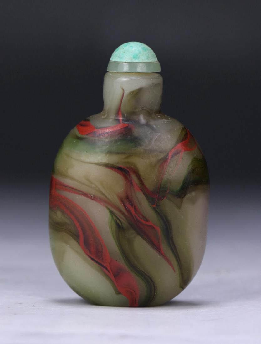 A CHINESE ANTIQUE PEKING GLASS SNUFF BOTTLE: A Chinese Antique Peking Glass Snuff Bottle:; Size: H: 2-3/4" (6.99cm)