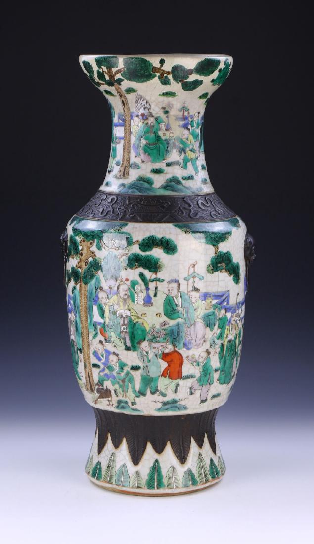 A CHINESE ANTIQUE FAMILLE VERTE PORCELAIN VASE: A Chinese Antique Famille Verte Porcelain Vase: Of Rounded Shoulder Form With A Cylindrical Neck Rising To A Wide Flared Rim, Finely Painted With The Scene Of Numerous Figures in Different Activities