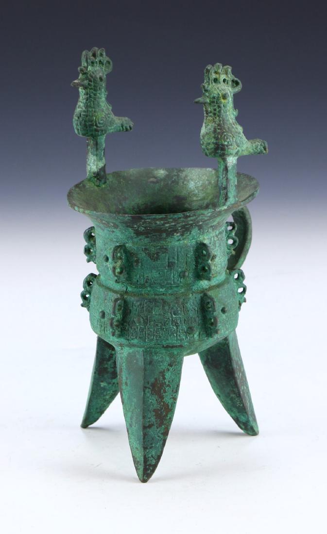 A CHINESE ARCHAIC BRONZE JUE CUP (1 of 4)