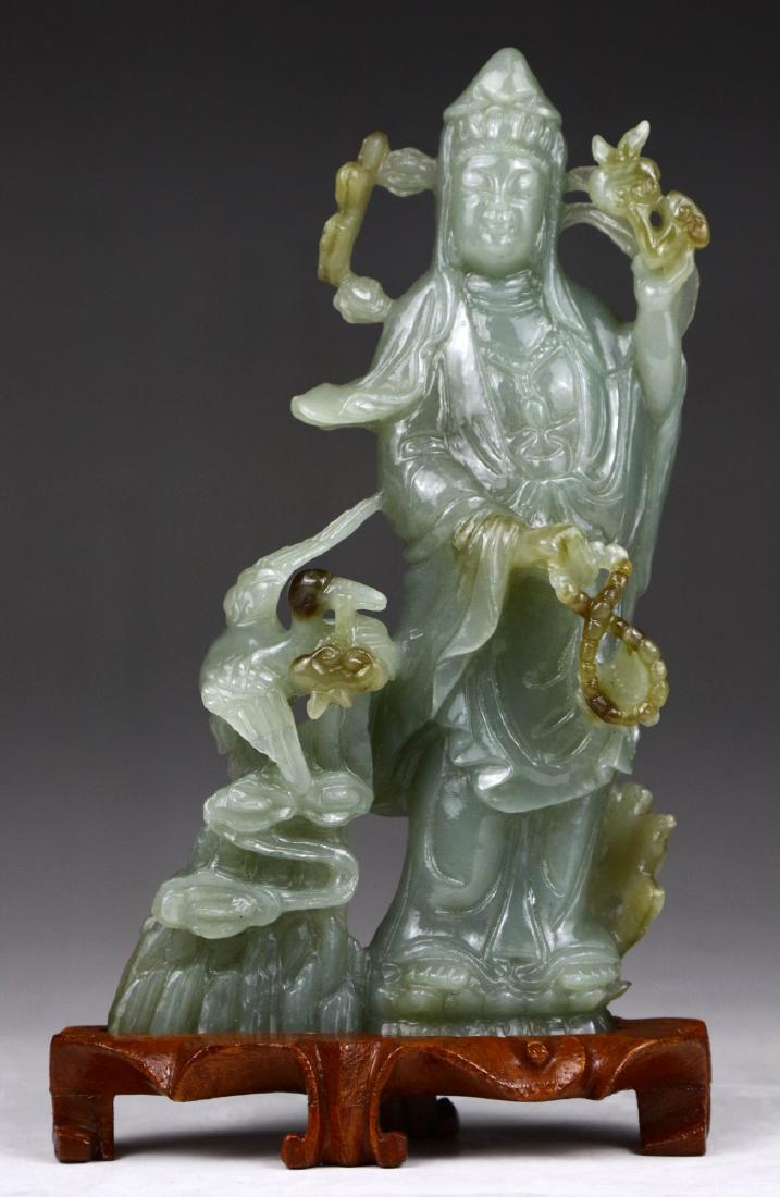 A CHINESE SEMI-TRANSLUCENT JADEITE CARVED GUANYIN (1 of 4)