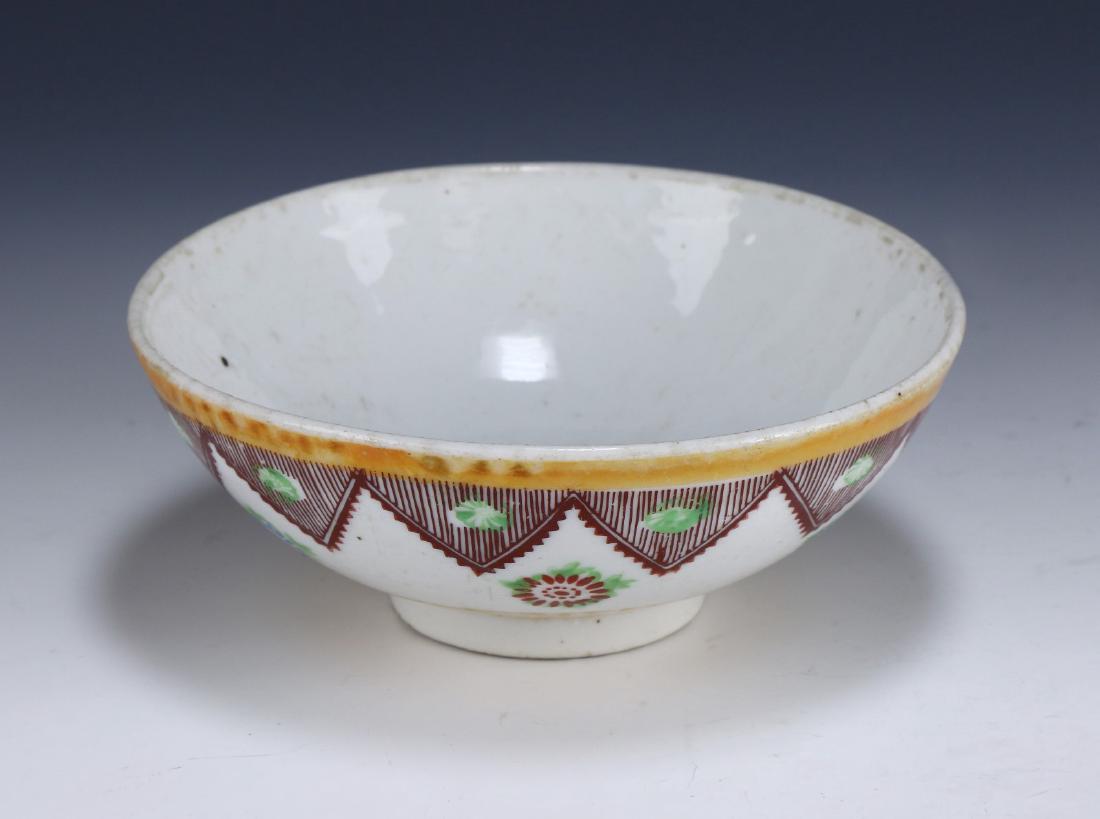 A CHINESE ANTIQUE FAMILLE ROSE PORCELAIN BOWL: A Chinese Antique Famille Rose Porcelain Bowl: Well Potted With Rounded Sides, Rising From A Base Rested On Low Feet, Exterior Finely Painted With Blooming Flowers Of Mixed Tones, Three Character Mark