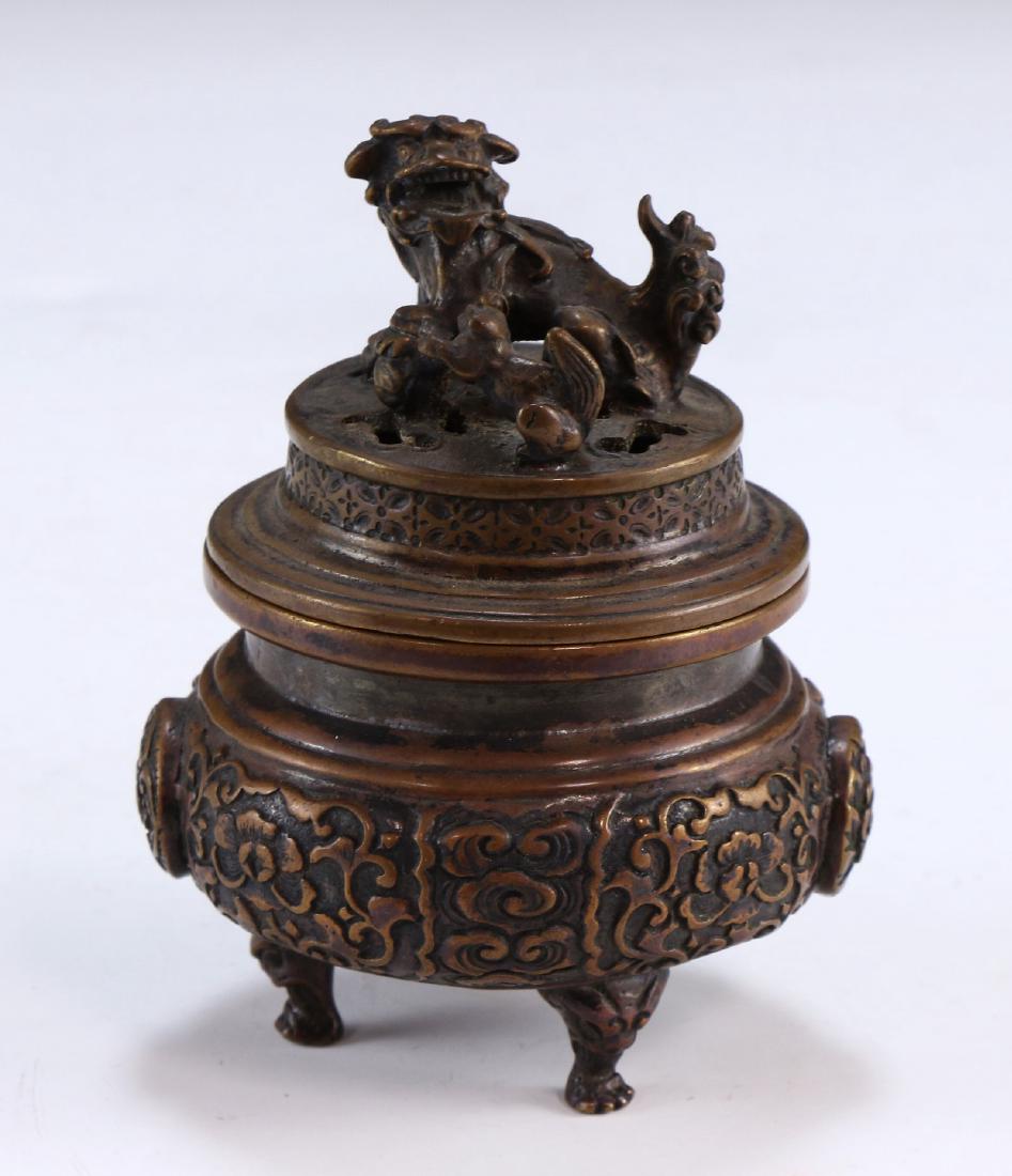A CHINESE ANTIQUE LIDDED TRIPOD BRONZE CENSER (1 of 5)