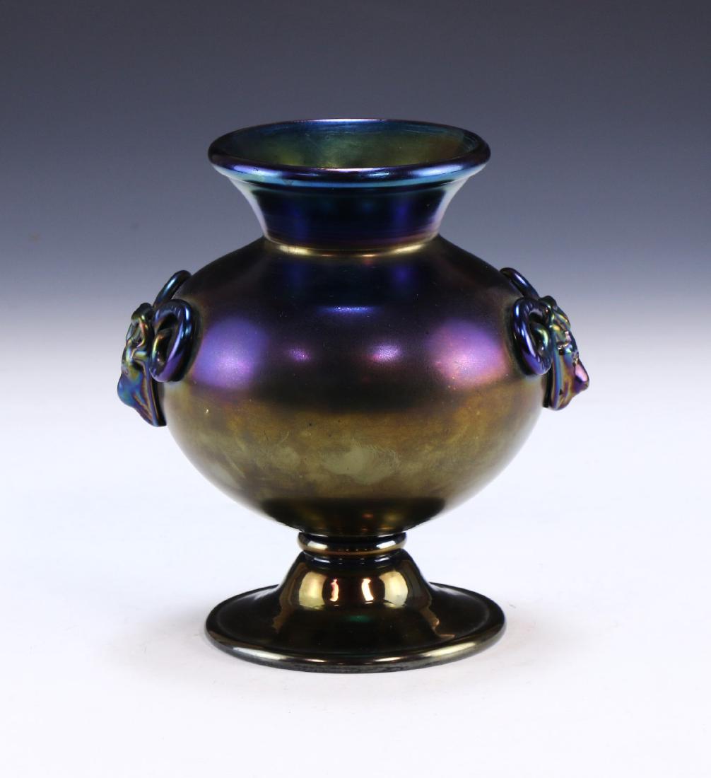 A CHINESE ANTIQUE GLASS VASE: A Chinese Antique Glass Vase: Body Of Globular Form, Finely Cast With Menacing Oxen Form Handles On Each Side, Mark Etched into The Exterior Base; Size: H: 6-1/4" (15.88cm)