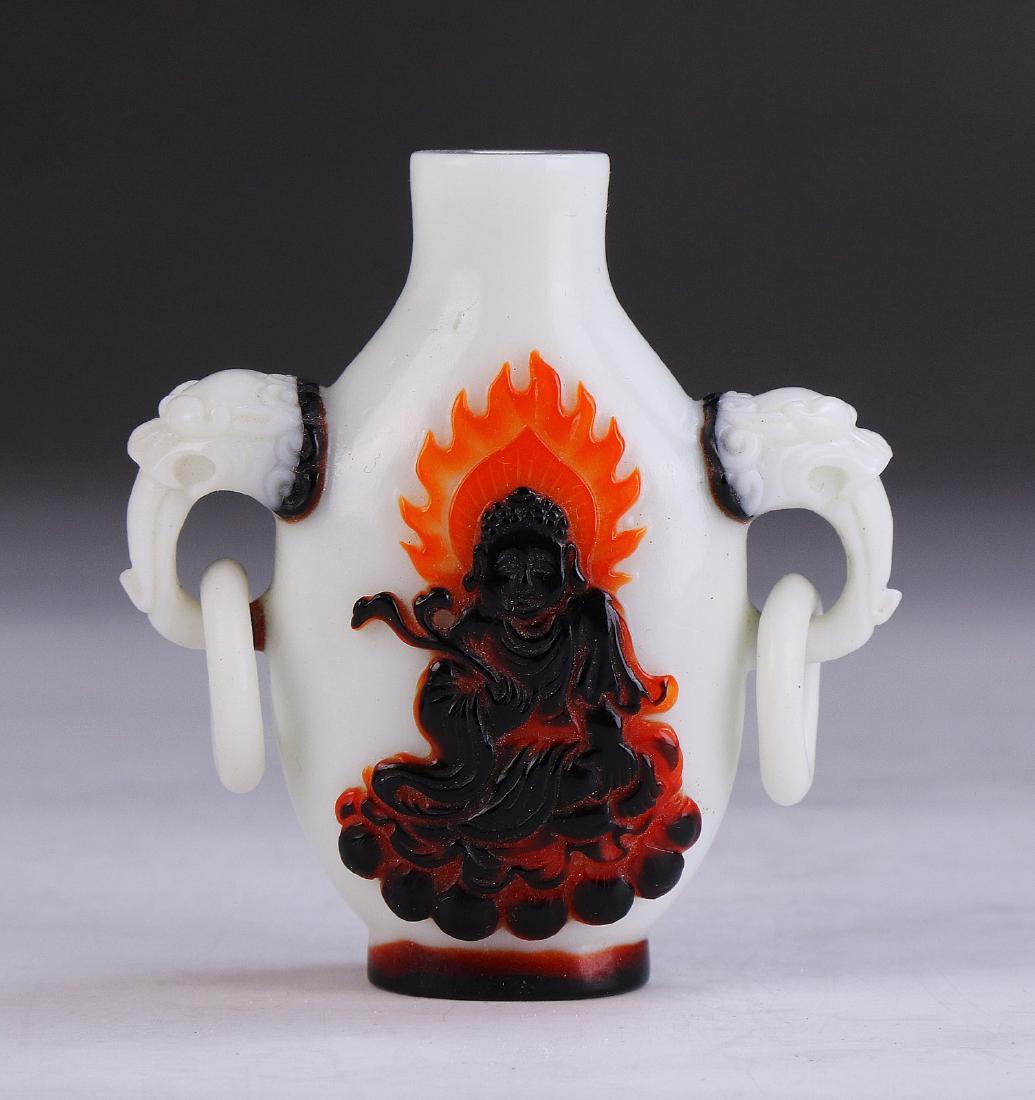 A CHINESE ANTIQUE PEKING GLASS SNUFF BOTTLE: A Chinese Antique Peking Glass Snuff Bottle: Of Bottled Form, Body Flanked On Each Side By Menacing Masks With Loose Ring Handles Attached, Finely Painted With Celestial Beings; Size: H: 2-3/4" (6.99c