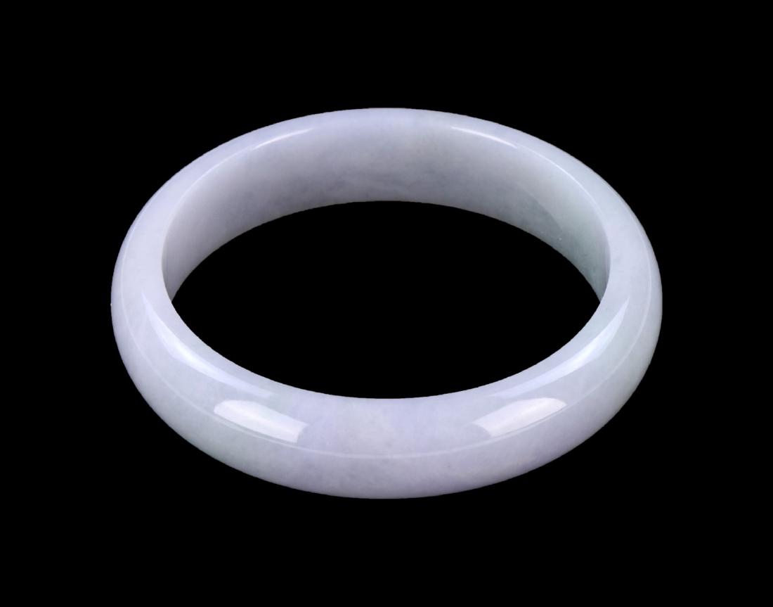 A JADEITE CARVED BANGLE (1 of 2)