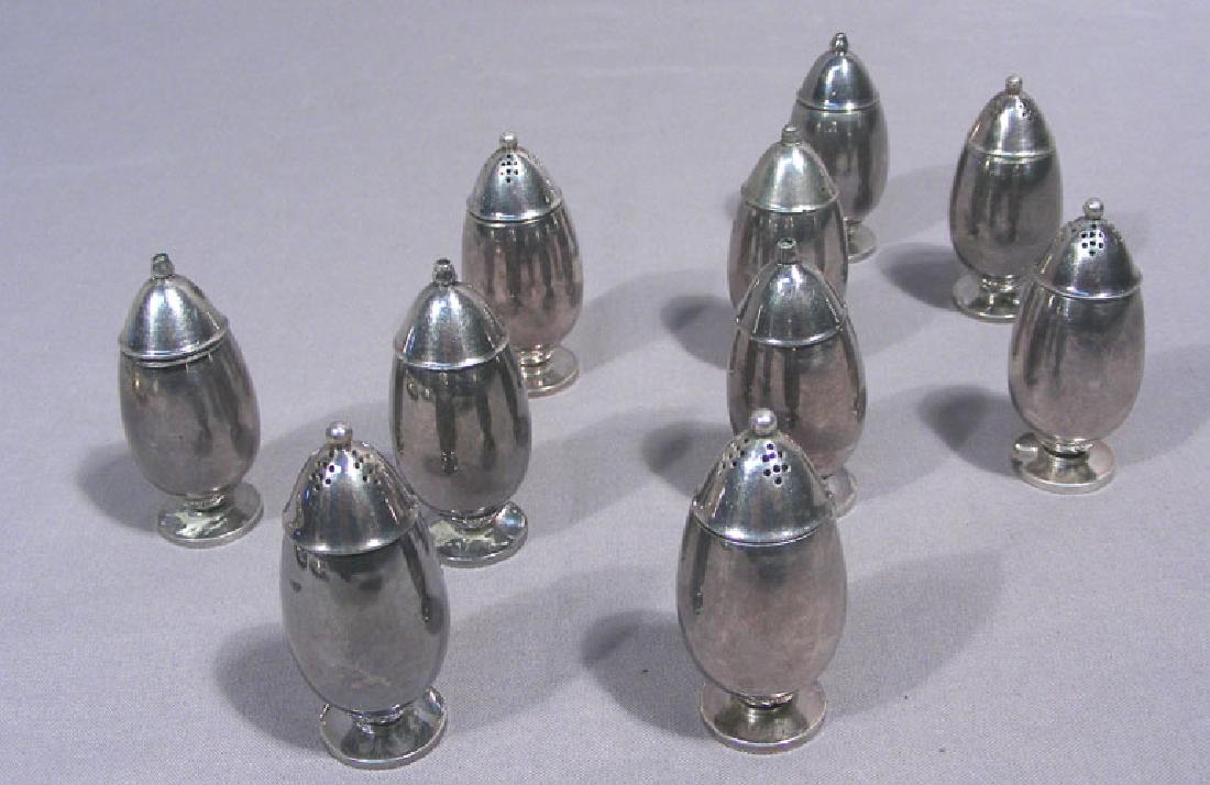 RARE VINTAGE GEORG JENSEN - FIVE PAIRS OF STERLING SALT: Cactus pattern. Each signed on base Denmark Serial # 629B. Stamped G.A. for designer Gundorph Albertus. 2" high.