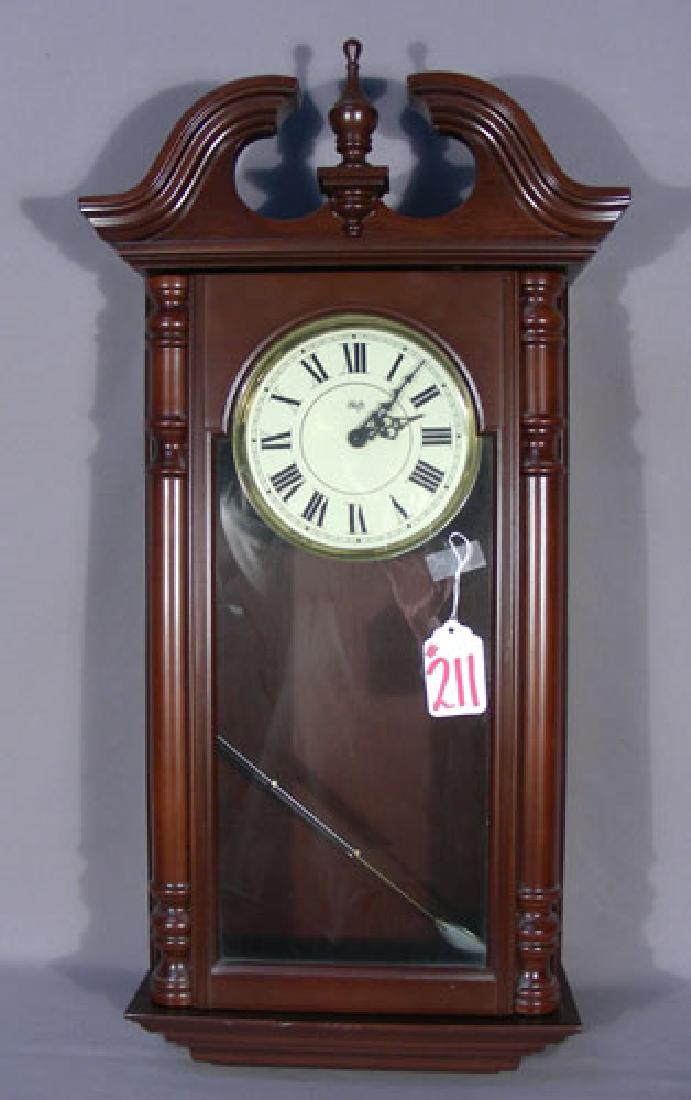 SLIGH WALL CLOCK: Excellent condition. Battery operated. 31" high, 15 1/2" wide.