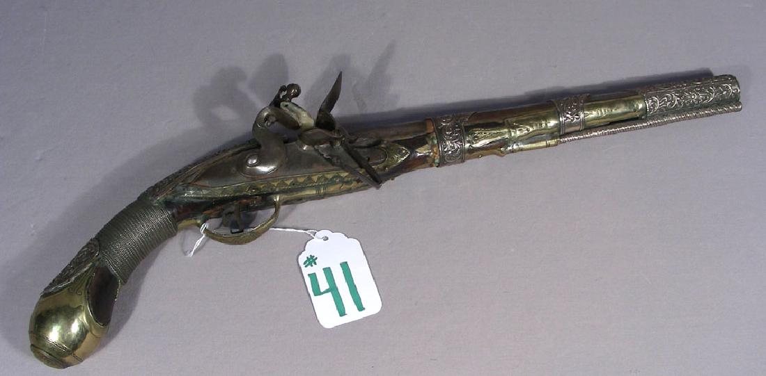 ANTIQUE TURKISH FLINT LOCK PISTOL: Ornate metal work. 21" long.