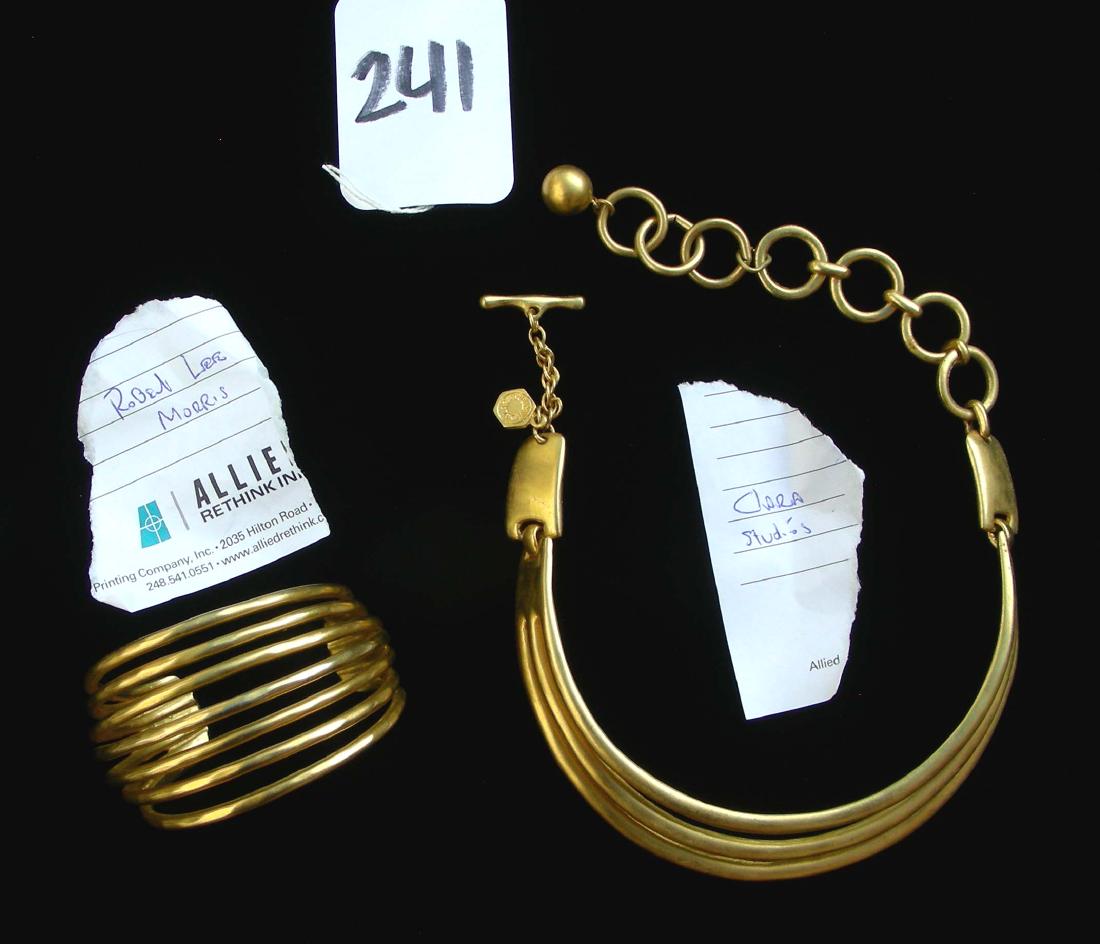 TWO DESIGNERS: ROBERT LEE MORRIS & CLARA STUDIOS: Robert Lee Morris 7 strand large gold tone bangle bracelet and Clara Studios gold tone triple tiered necklace. Each signed.