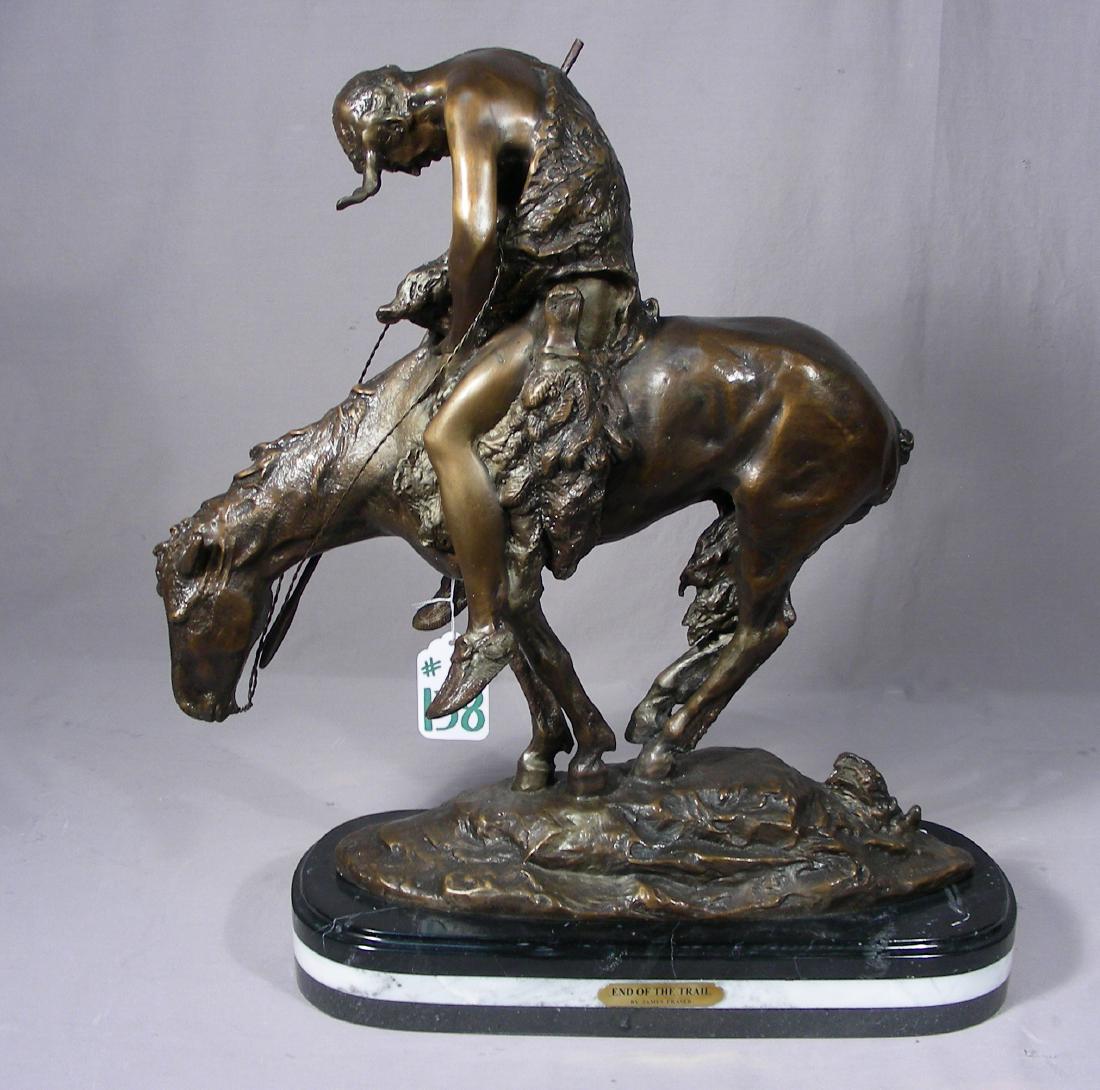 BRONZE SCULPTURE "END OF THE TRAIL" AFTER JAMES EARLE: Very fine detail. Brown patina. Signed. Black & white marble base. 22" high, 20 1/2" long.