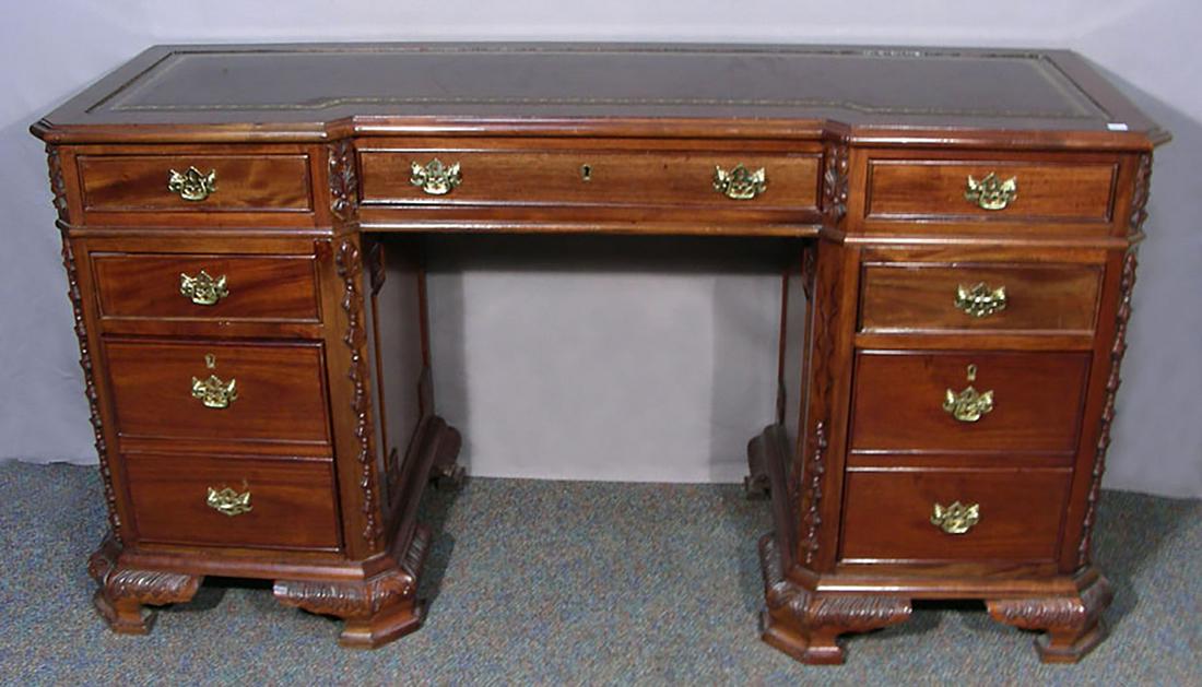ENGLISH HAND CARVED MAHOGANY CREDENZA/DESK: Brown leather top. Seven drawers. 30" high, 58" wide, 19" deep.