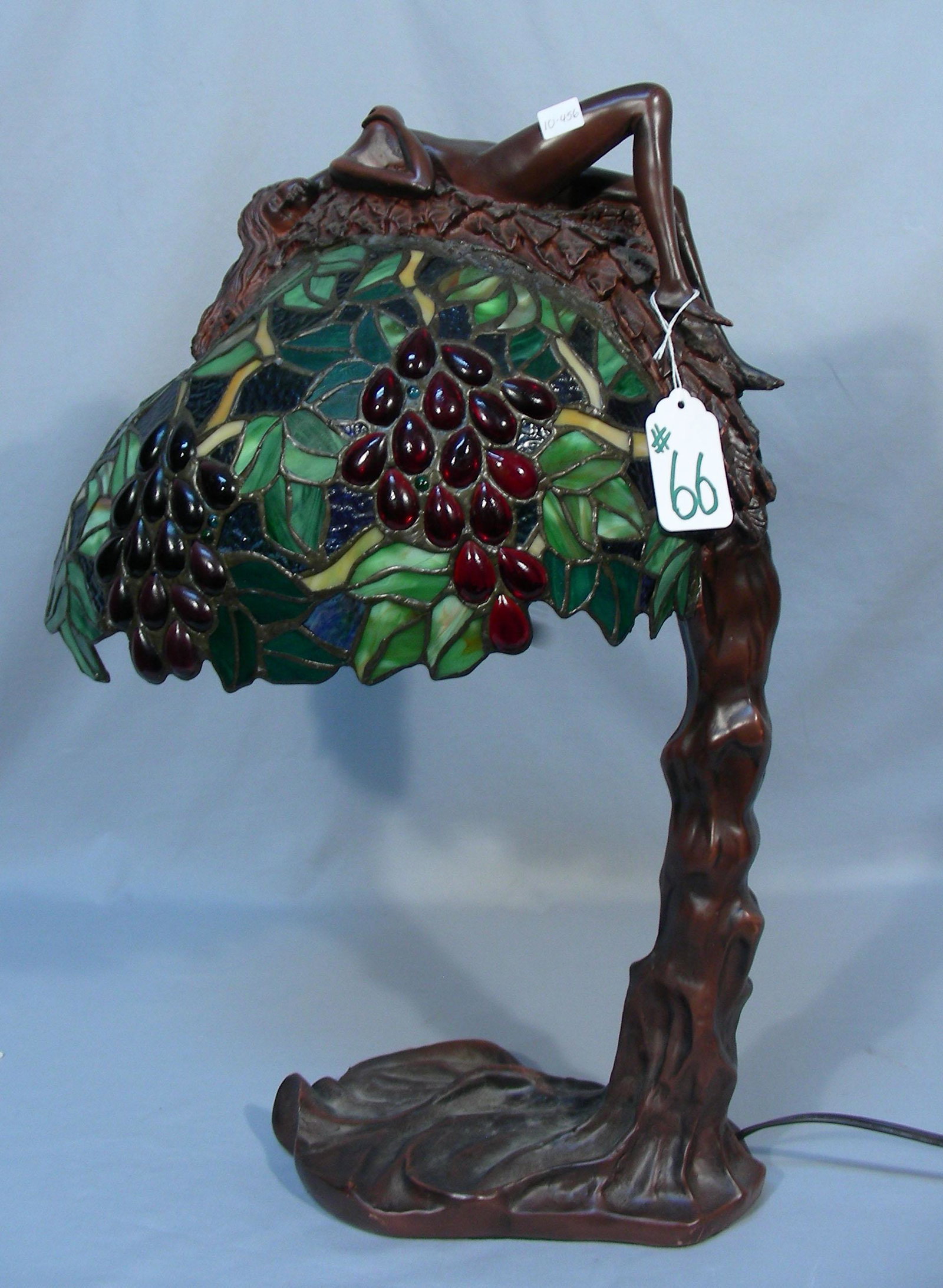 BEAUTIFUL LEADED GLASS TABLE LAMP WITH RECLINING NUDE: An ornate base supports a domed multi colored leaded glass shade with reclining nude woman. Fine detail. 24" high.