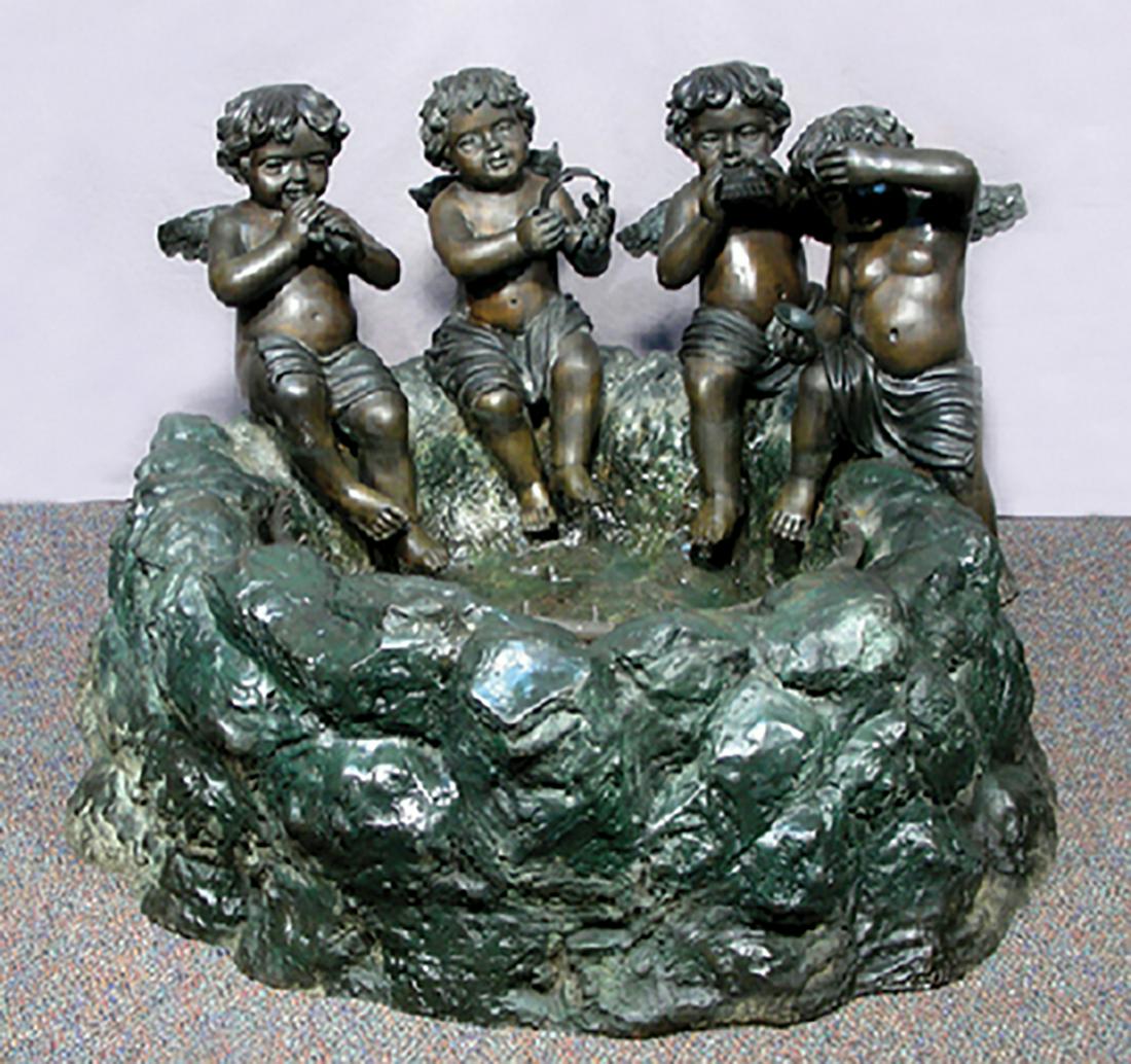 VINTAGE BRONZE SELF CONTAINED CHERUB FOUNTAIN: Four cherubs seated on rim of fountain play musical instruments. Aged patina. 24" high, 40" wide, 38" deep.