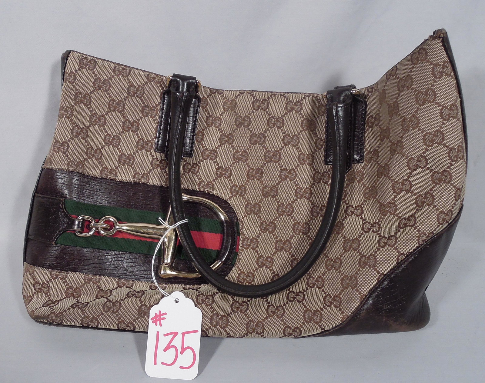 VINTAGE GUCCI PURSE WITH GREEN & RED STRIPE AND HEAVY: 9 1/2" high, 15 1/4" wide. We are not experts in hand bags so please review all photos and make your own determination.