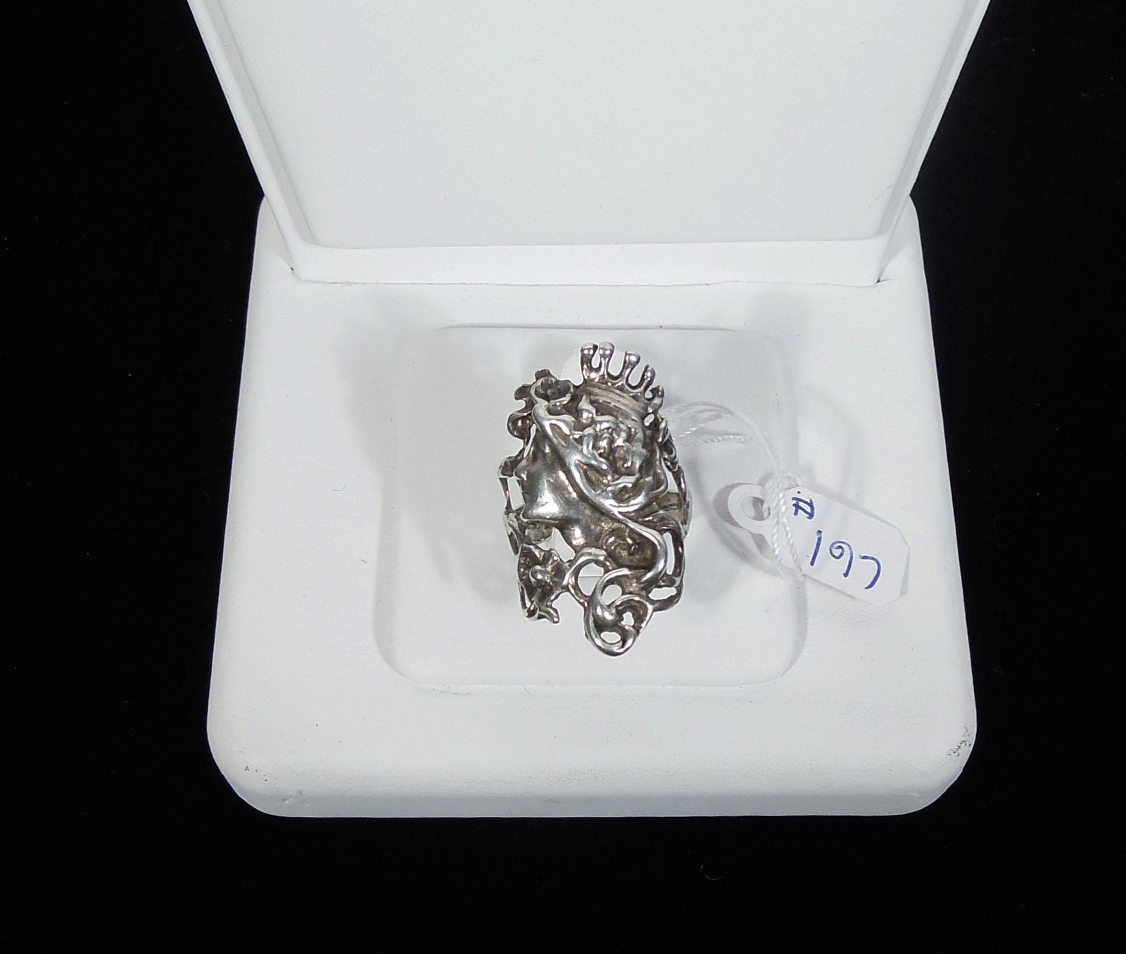 VINTAGE STERLING SILVER RING WITH BUST OF WOMAN: An ornate ring with bust of woman wearing a crown. Size 6 1/2.