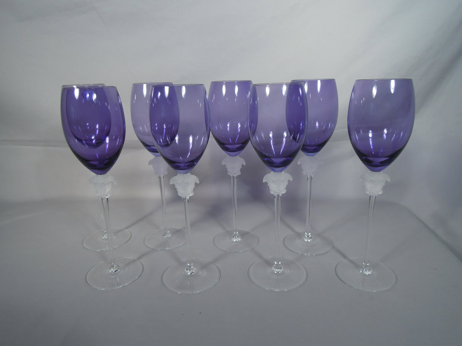 GROUP OF EIGHT ROSENTHAL VERSACE "MEDUSA" WINES: Amethyst coloration. Six signed.