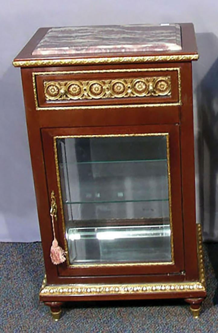 WOOD, GILT METAL VITRINE WITH MARBLE TOP: Ornate ormolu appointments. Beveled glass front door. Maroon & beige marble top. 30" high, 17" wide, 14" deep.