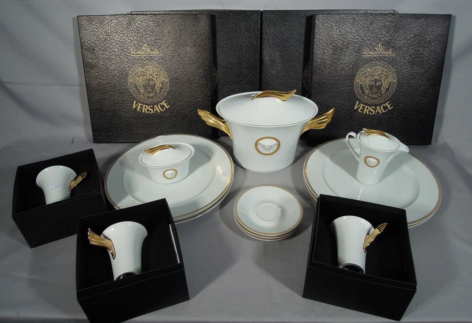 ROSENTHAL VERSACE "D'OR" 13 PIECE SET: Set includes: 4 dinner plates, 3 cups and saucers, 1 covered bowl with wings and creamer & sugar. Some with original boxes.