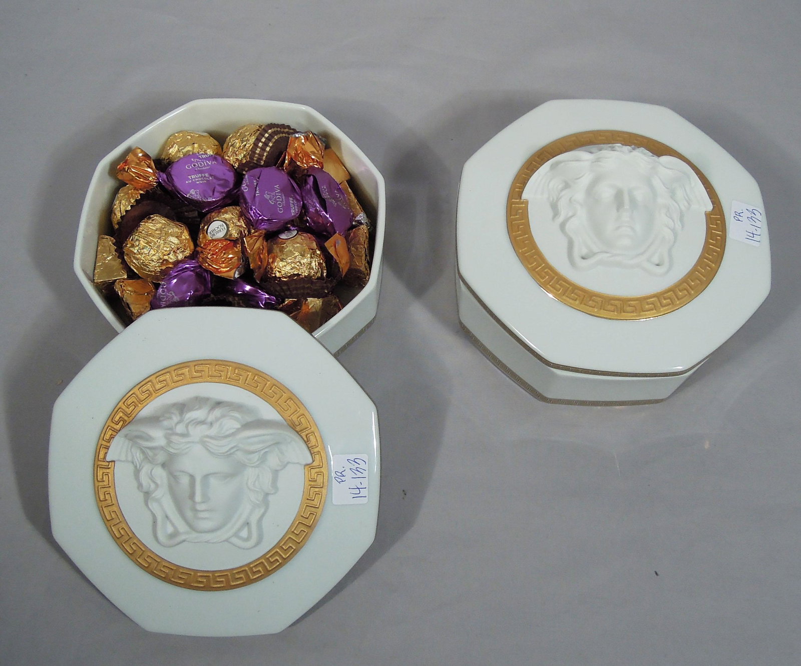 PAIR ROSENTHAL VERSACE "GORGONA" MEDUSA COVERED BOXES: Each signed on base. Each 3 1/3" high, 6 1/4" dia.