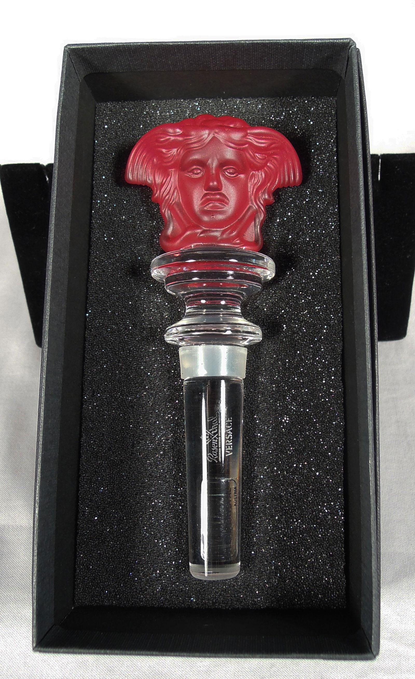 ROSENTHAL VERSACE WINE STOPPER: Medusa head in crimson coloration. Signed. Original box.